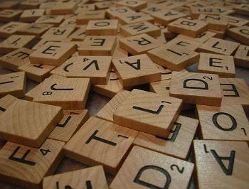 Scrabble Club A pile of Scrabble letter tiles